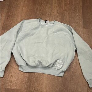 Light blue H&M girls sweater. Size Large.